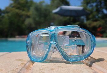 Snorkel mask by the pool