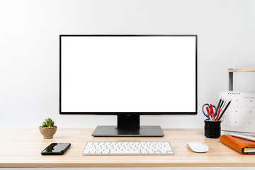 Workspace - Mockup computer PC isolated white screen on desk with smartphone, keyboard, mouse and working accessories