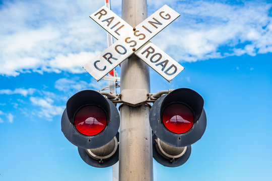 Railroad crossing sign with light signal