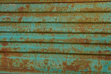 Fototapeta na wymiar green brown texture of metal from an old rusty wall