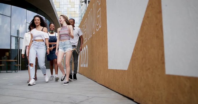 Group of teenagers walking through city