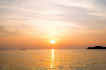 Fototapeta premium Beautiful of sunrise with colorful sky in summer time concept travel, holiday and vacation. Tropical paradise beach nature landscape at Lipe island in Thailand.