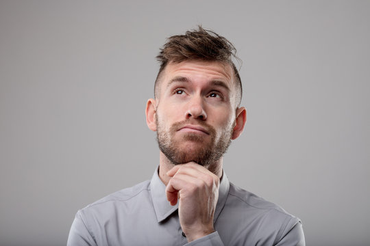 Thoughtful man pondering a problem