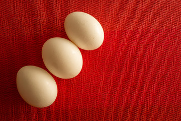 Fresh farm eggs  in a bowl on a wooden rustic background