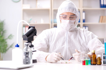 Biotechnology scientist chemist working in lab