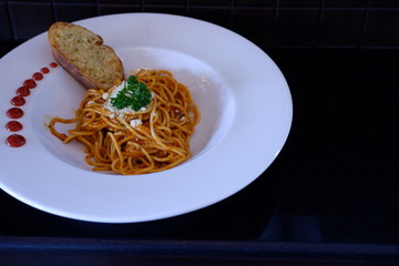 spaghetti bolognese on wooden background