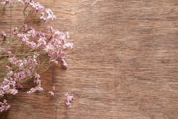 Fototapeta na wymiar flowers on wooden background
