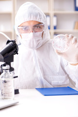 Biotechnology scientist chemist working in lab