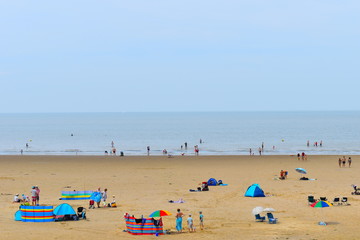 Tourists on their summer holidays, Minnis Bay, Birchington, Kent, UK
