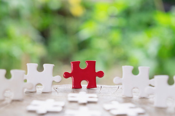 Jigsaw puzzle connecting on wooden and nature background, Strategic management and business...
