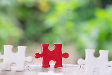 close up of puzzle pieces on wooden, business and connection concept