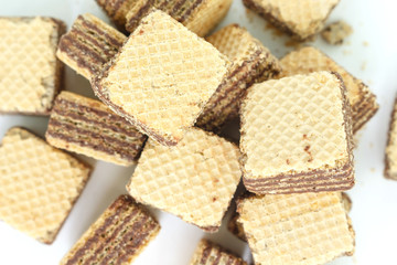 wafer chocolate pile dessert top view on white background
