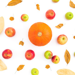 Thanksgiving autumn background with fall dried leaves, apple fruits and orange pumpkin on white background. Flat lay, top view