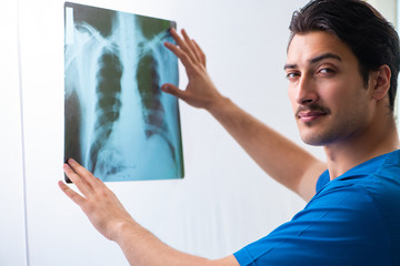 Young handsome doctor radiologyst working in hospital   