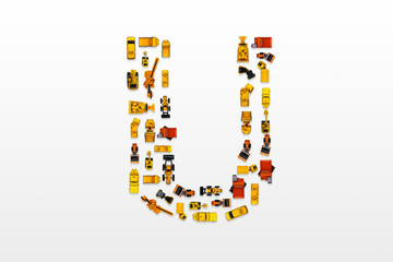 English letters formed by arrangement of Car toy diecast on the white background , Top view