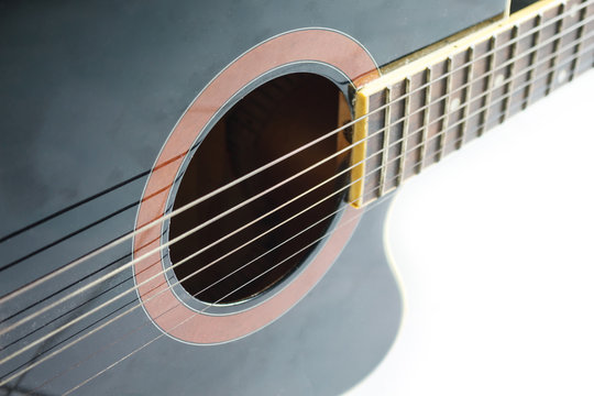 black guitar classic on white background.