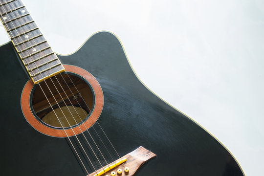 black guitar classic on white background.