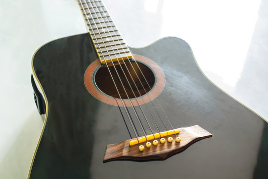 black guitar classic on white background.