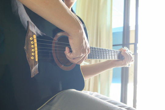 Playing guitar as a hobby.