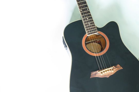 black guitar classic on white background.