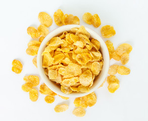 corn flakes on white bowl on white background.