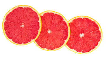 Grapefruit slices isolated on white background top view