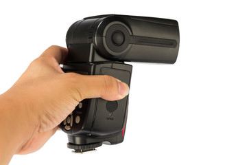 an adult hand holding a flash light