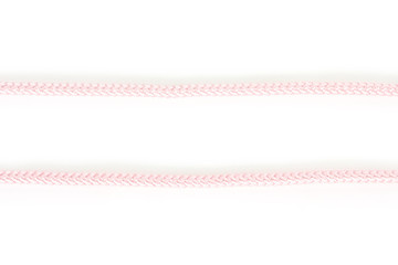 pink threads on white background