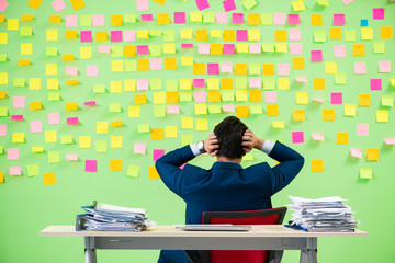 Businessman having trouble with his priorities