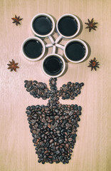 Obraz na płótnie Canvas Flower of coffee beans and mugs with coffee