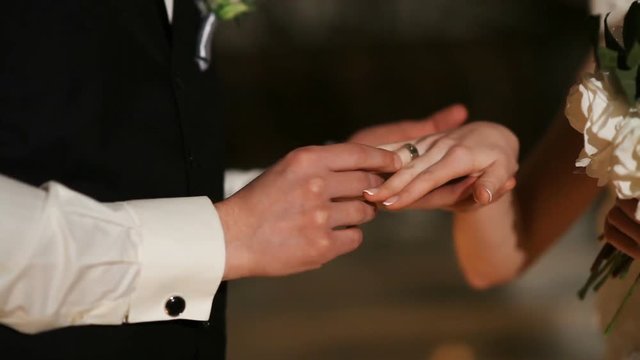 The groom wears the ring on the night ceremony