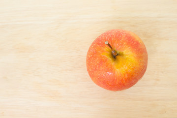 red apple top view on wooden background