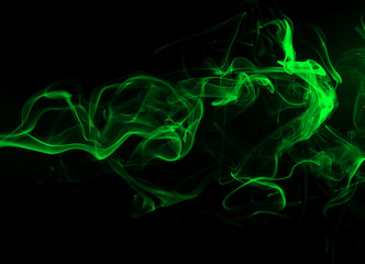 Green Smoke abstract on black background and darkness concept