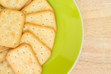 craker on plate on wooden background.