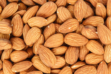 Fototapeta premium heap almonds top view texture background.