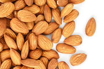 heap almonds top view frame or border on white background.