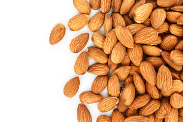 heap almonds top view frame or border on white background.