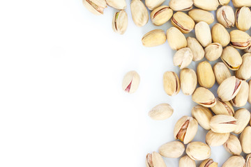 pistachio top view frame or border on white background.