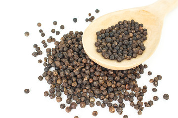 peppercorns in spoon heap on white background.