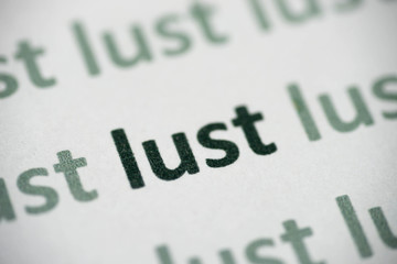 word lust printed on paper macro