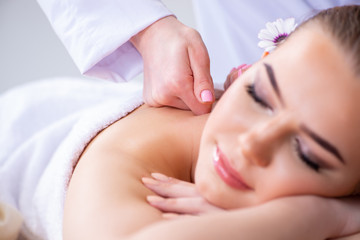 Woman during massage session in spa