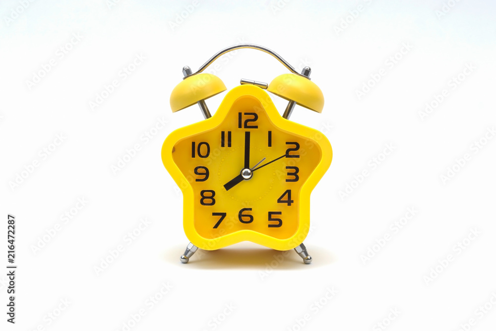 Wall mural the yellow alarm clock isolated on white background