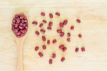 red bean seed spoon vegetable nature on wood background