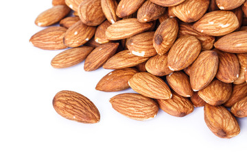 heap almonds on white background.