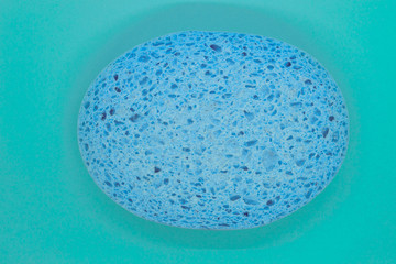 Abstract composition of blue sponge on blue background surface