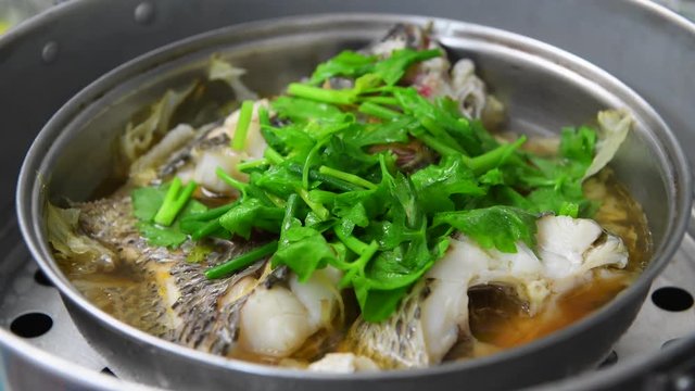 steamed fish with herbs and vegetable