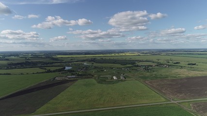 Fototapeta na wymiar Aerial view of green field and clouds