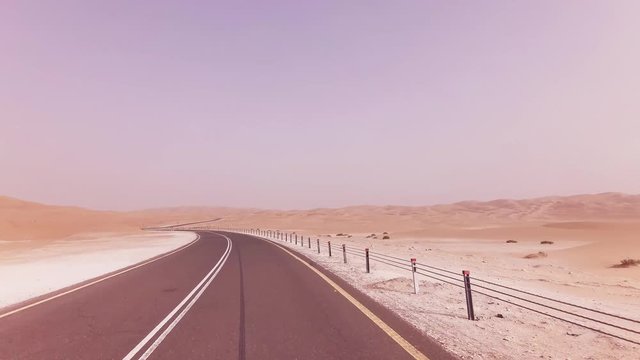 New road from Oasis Liwa to Moreeb Dune in Rub al Khali desert stock footage video