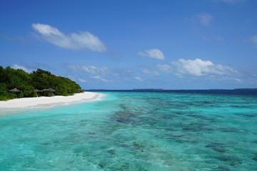 Fototapeta na wymiar View of a beautiful beach with turquoise water in Baa Atoll, Maldives