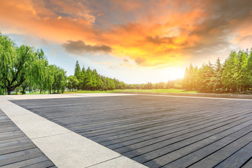 Wood square floor and green trees natural landscape